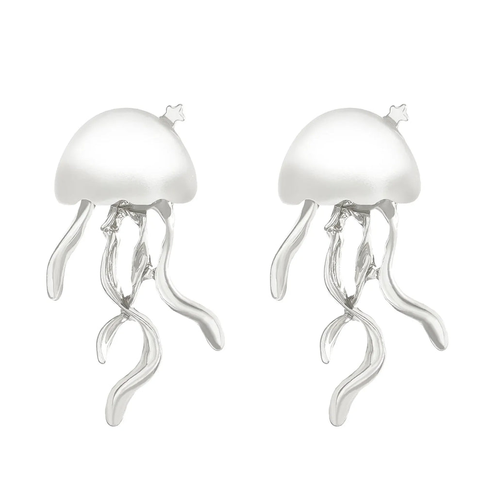 Alloy jellyfish tassel necklace and earring set in electroplated white finish on display