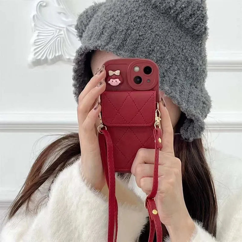 Red TPU crossbody card holder with lanyard for iPhone 15 showing diamond plaid pattern and rear card slot