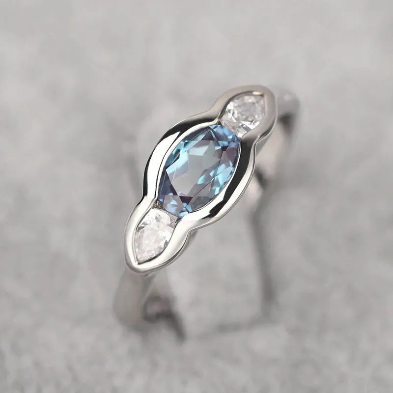 Women's geometric ellipse ring with zircon stone in white gold colour finish on model finger