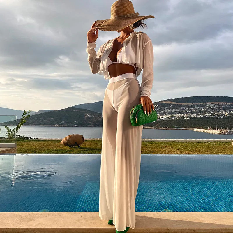 White women's 4-piece swimsuit set with high-waisted trousers and backless top