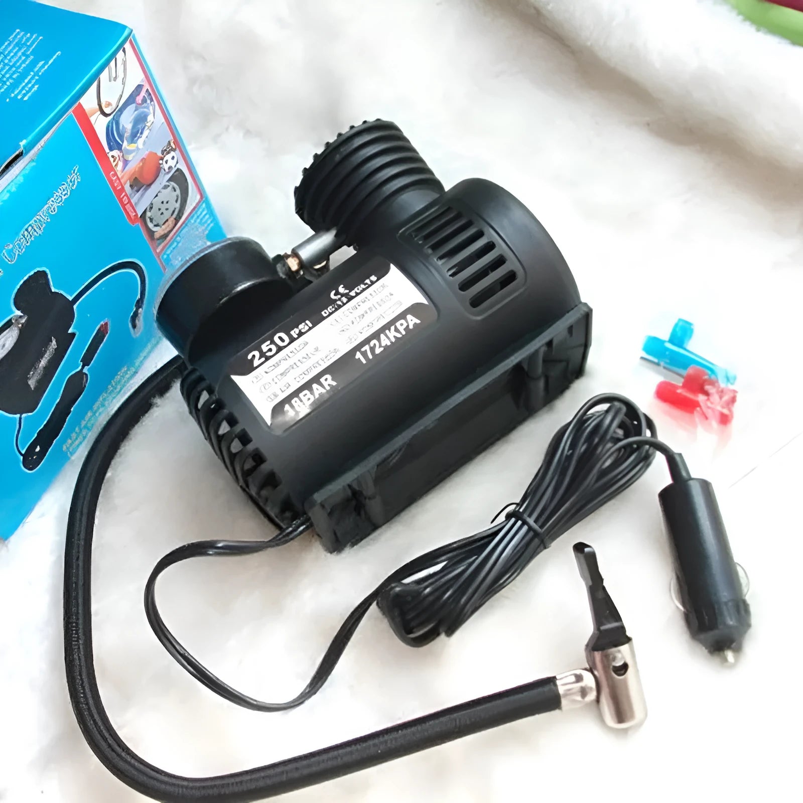 Black 12V portable mini car tyre air pump with dimensions 13.5x12x7cm.