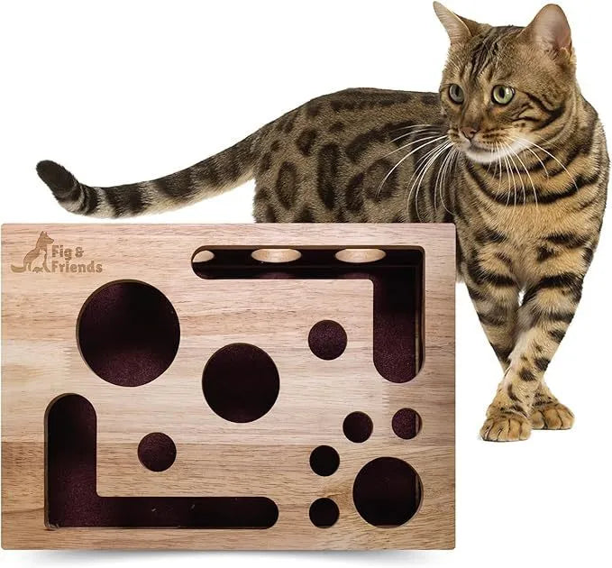 Solid wood square maze cat toy in natural wood colour on a floor