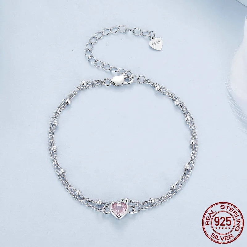 Women's sweet style sterling silver 925 bracelet with small heart-shaped charm on an adjustable chain.
