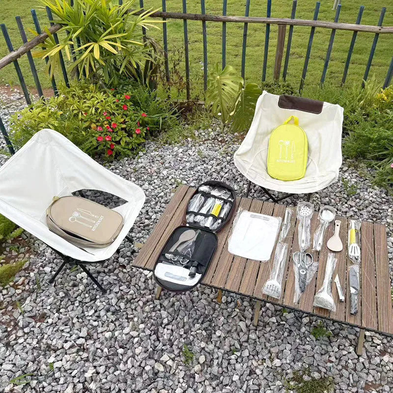 Brown portable storage bag containing a 12-piece stainless steel picnic kitchenware set.