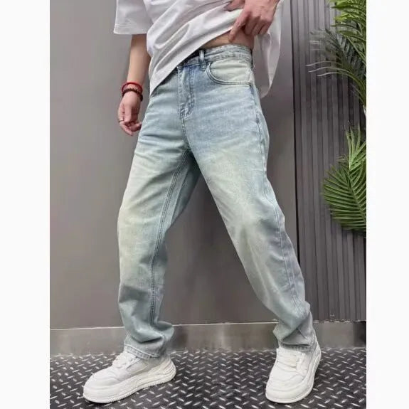Light blue straight slim denim trousers for teenagers with mid-rise waist and zipper fly closure