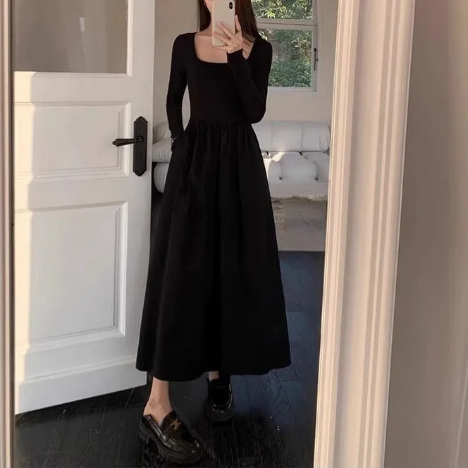 Black knitted square collar dress with long sleeves and an A-line skirt on a mannequin.