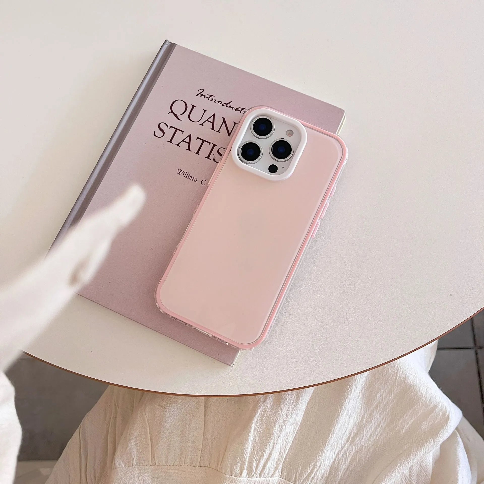 Clear jelly iPhone phone case in solid blue colour on an iPhone, showing bumper-style all-inclusive protection.