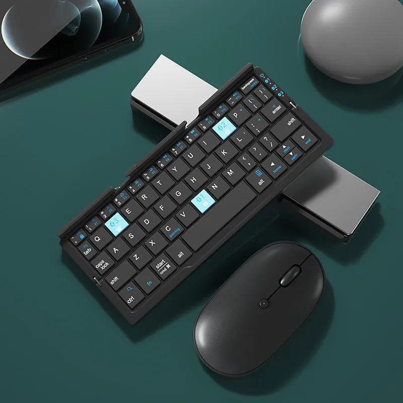 Silver white folding Bluetooth keyboard with integrated stand holding tablet at angle