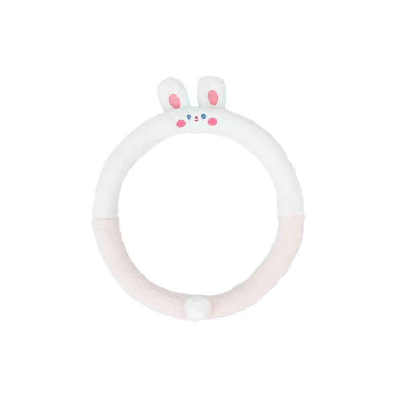 Plush rabbit fur steering wheel cover with embroidered panda design, shown fitted on a car wheel.