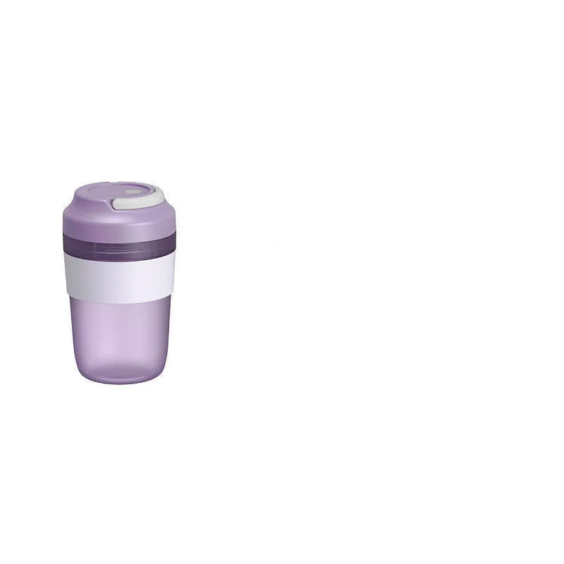 Grape purple portable blender cup with four stainless steel blades and USB charging cable.