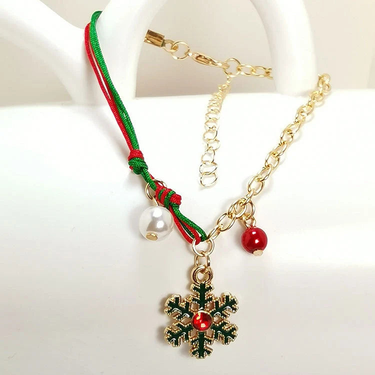 Christmas charm bracelet with snowman, Santa Claus, and snowflake designs