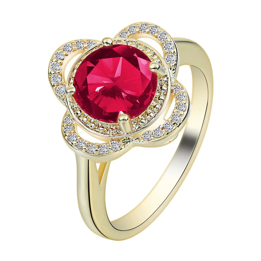 Copper ring with a fruit-shaped zircon stone inlay on a finger.