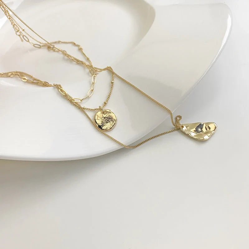 Multi-layer unisex clavicle chain with geometric triangle pendant and snake bones chain