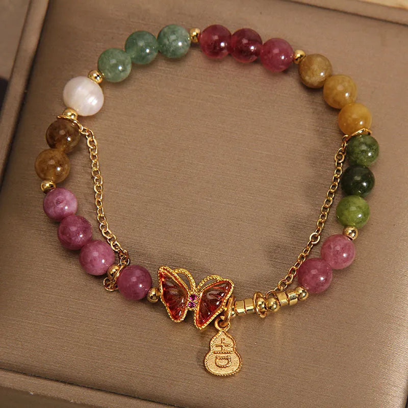 Natural jade green agate bracelet with a carved tourmaline butterfly gourd centrepiece.