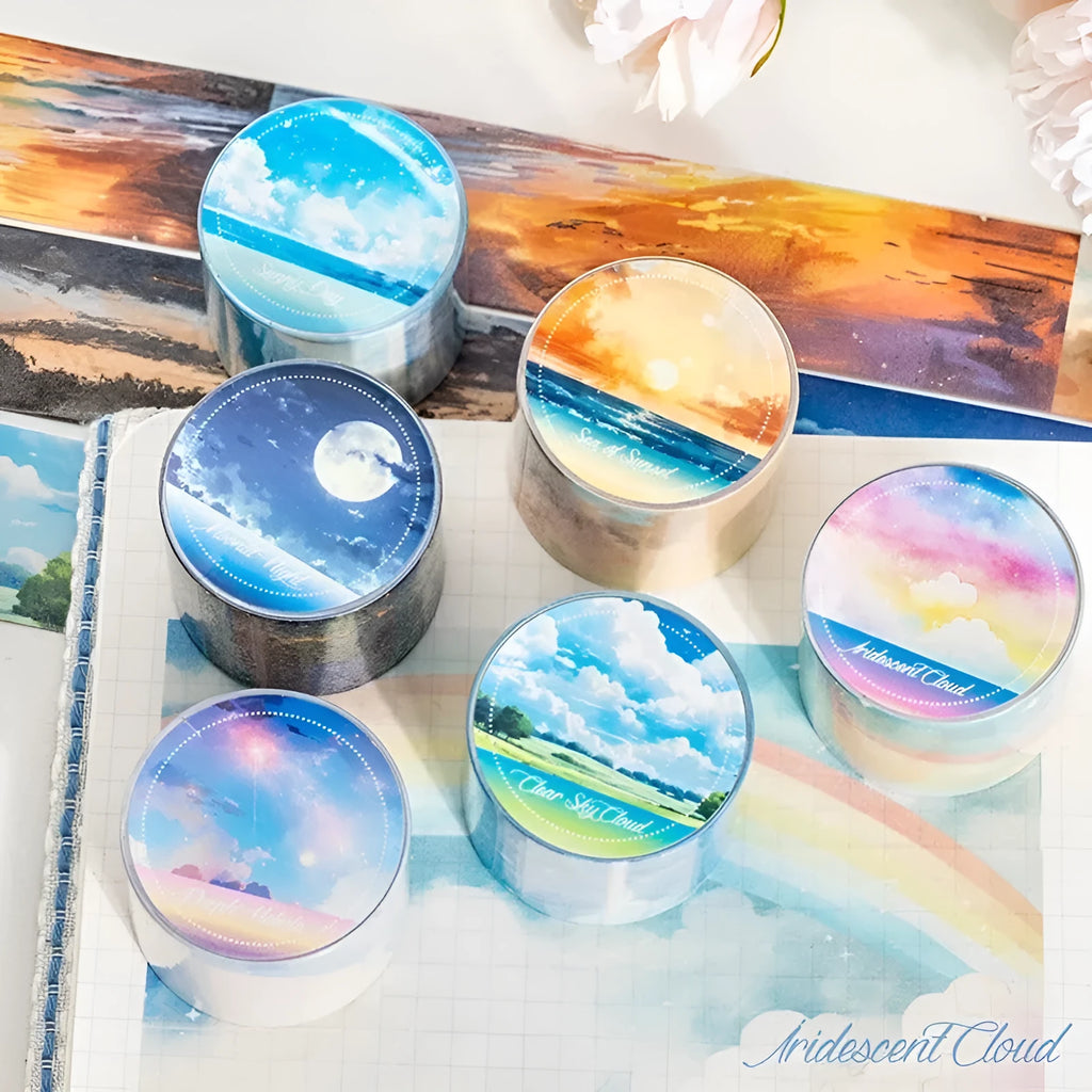 Japanese paper washi tape roll with sky theme designs including clouds, sun, moon, and nebula patterns