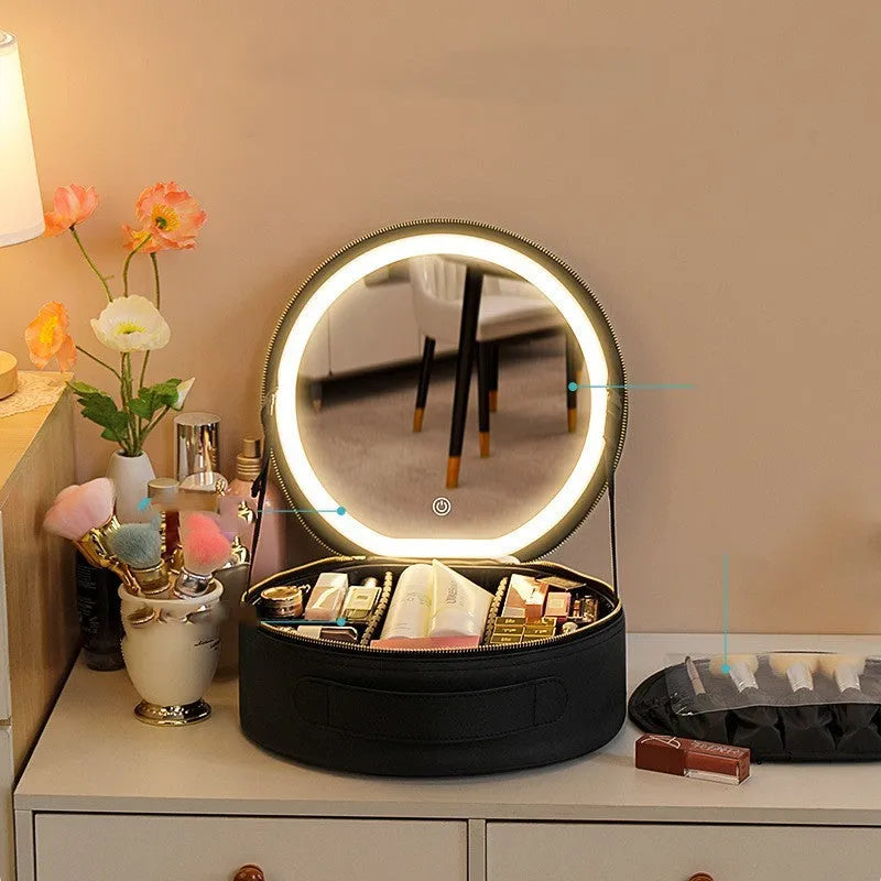 Round pink LED makeup bag open showing internal partitions and illuminated mirror.