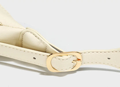 Women's soft PU crescent crossbody bag with internal compartments in white and black