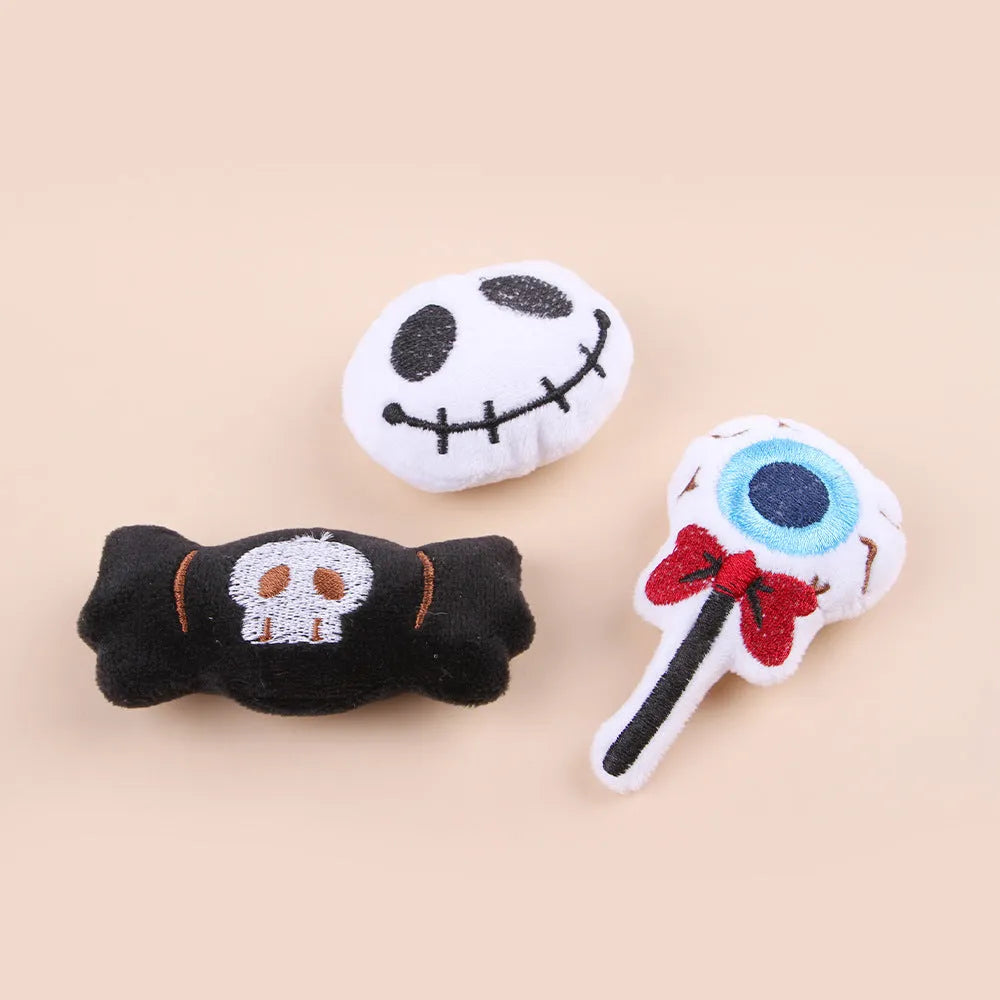 Small plush candy cat teaser wand on a stick in one of three colour designs: Eyes, Candy, or Skull.