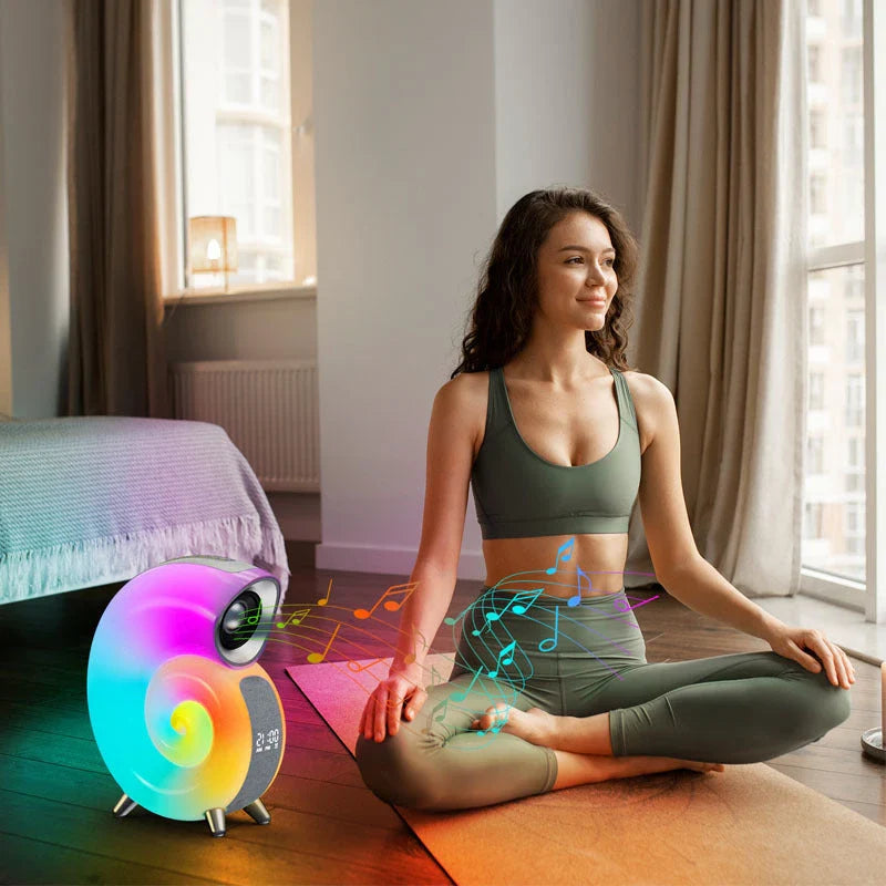 A smart RGB atmosphere light with Bluetooth speaker, alarm clock, and white noise machine for customizable sleep and relaxation.