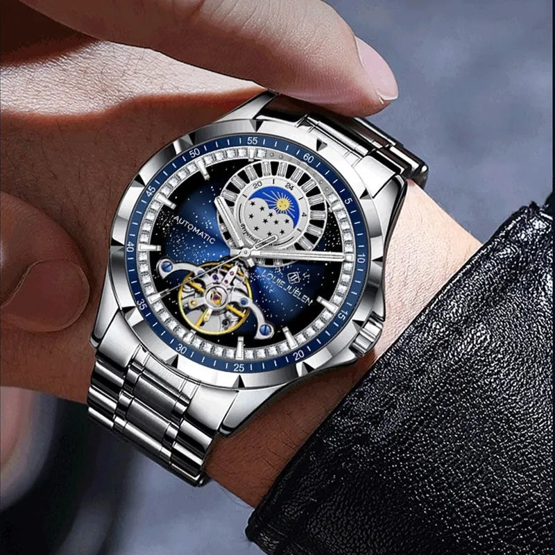 Men's silver and blue automatic mechanical watch with stainless steel strap on wrist