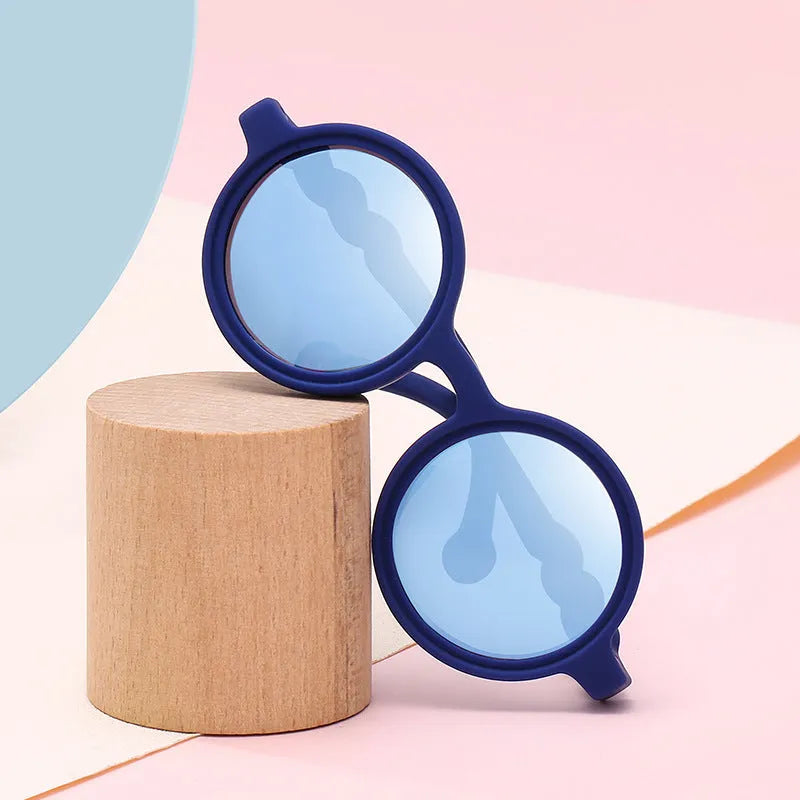 Children's sunglasses with UV400 polarised lens and nylon elastomer frame in seven colours