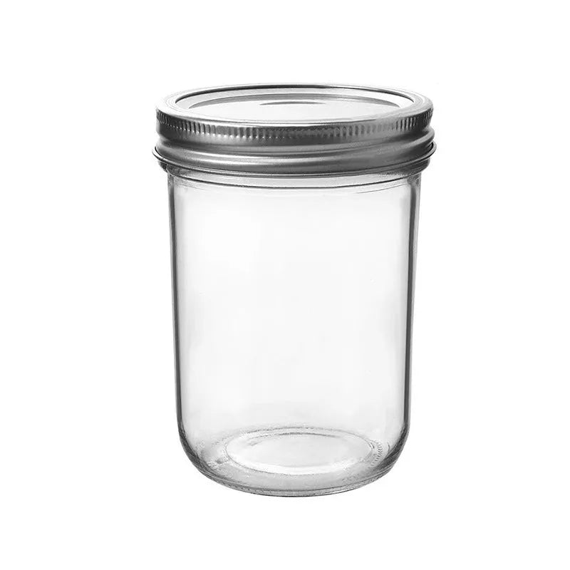 Six 16oz transparent glass jars with wide mouths and sealed lids on a shelf