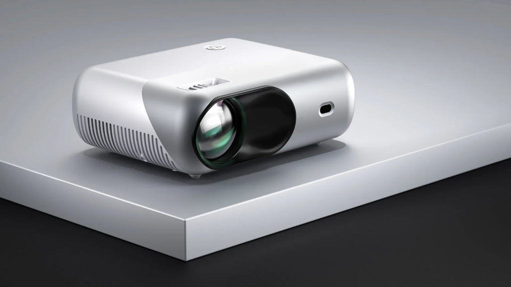 White portable WiFi HD 1080p projector with focus ring and remote control on a table