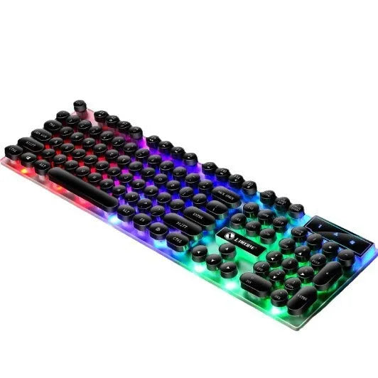 TX35 mechanical feeling keyboard in white and black rainbow colour options next to a laptop.