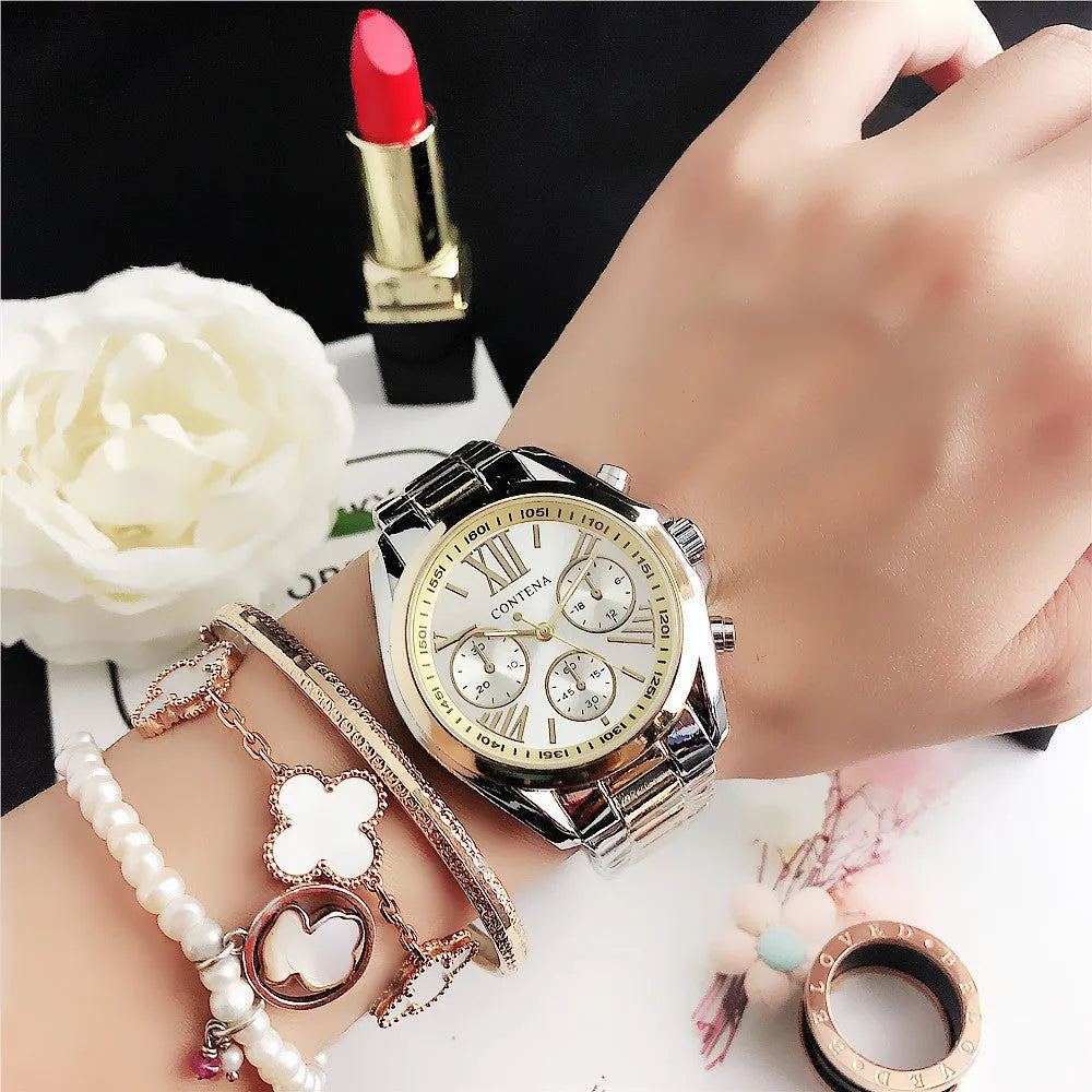 Women's silver rose gold diamond quartz analogue watch with mesh strap on wrist