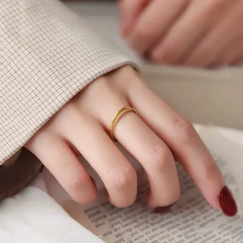 Brass gold plated women's ring shown in simple bracelet matte, glossy, and twist styles on a neutral background.