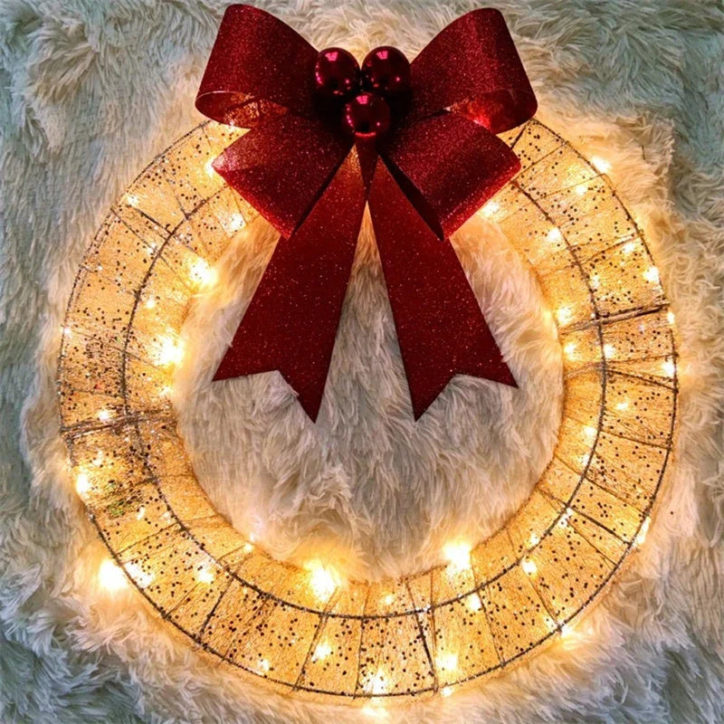 Festive 20-inch luminous LED Christmas wreath with gold and green tinsel garland and large bow