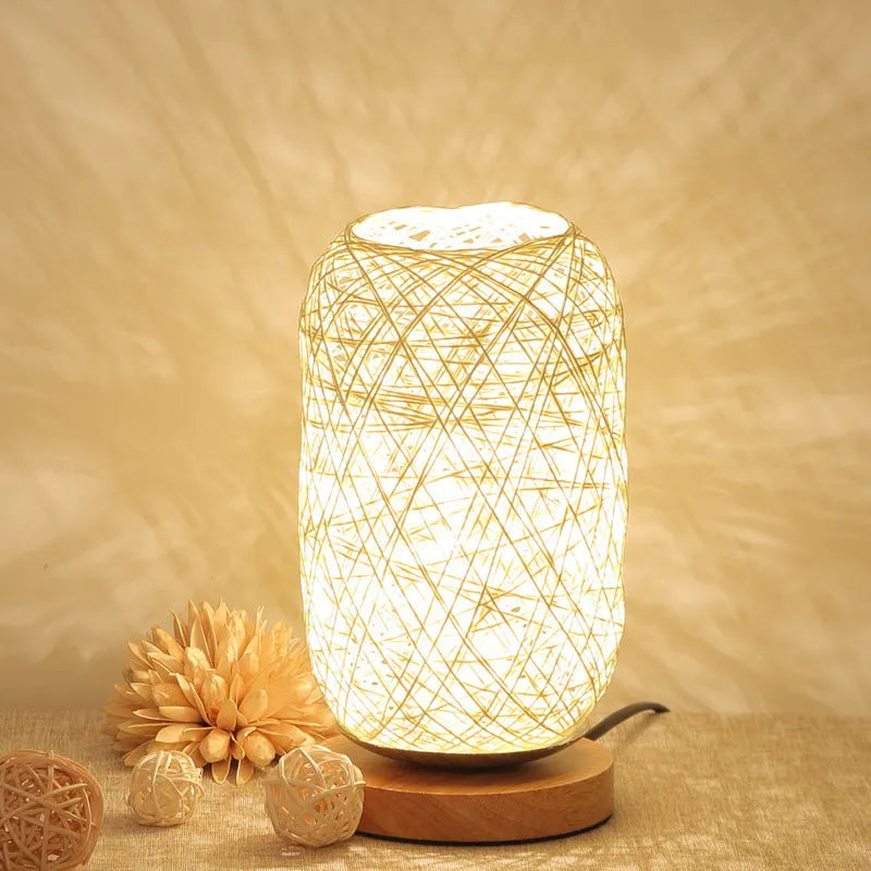 Dimmable LED night light with wooden twine vine finish on a bedside table, warm light, beige lampshade