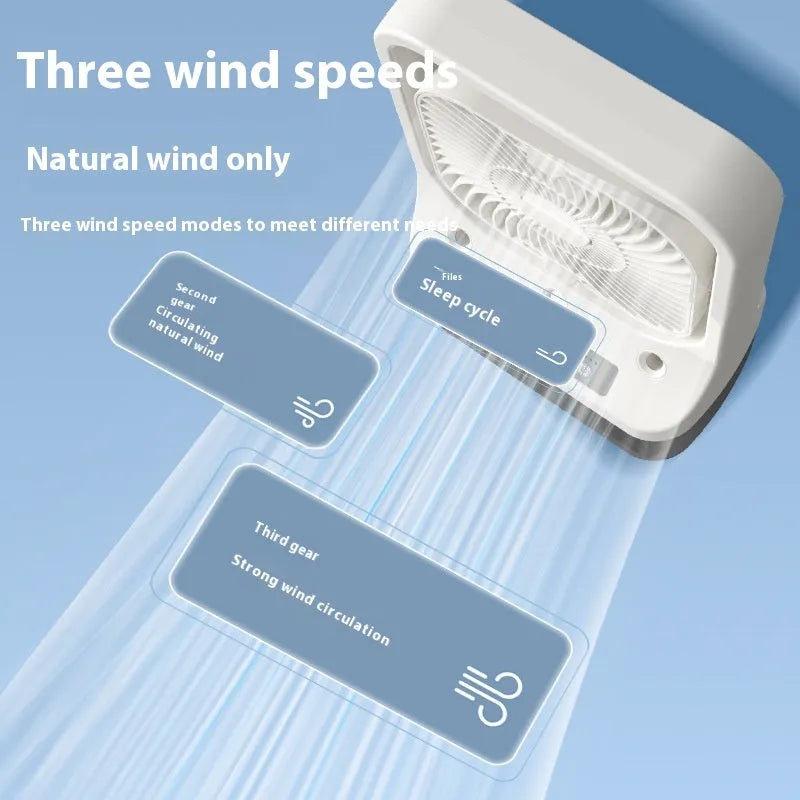 White USB rechargeable portable air cooler with adjustable head and water tank on a tabletop.