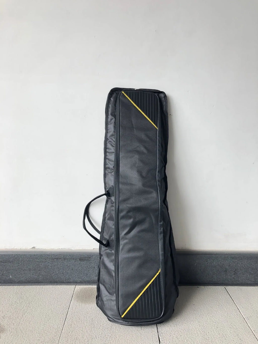 Black tenor trombone bag made of Oxford cloth with padded interior and outer pocket