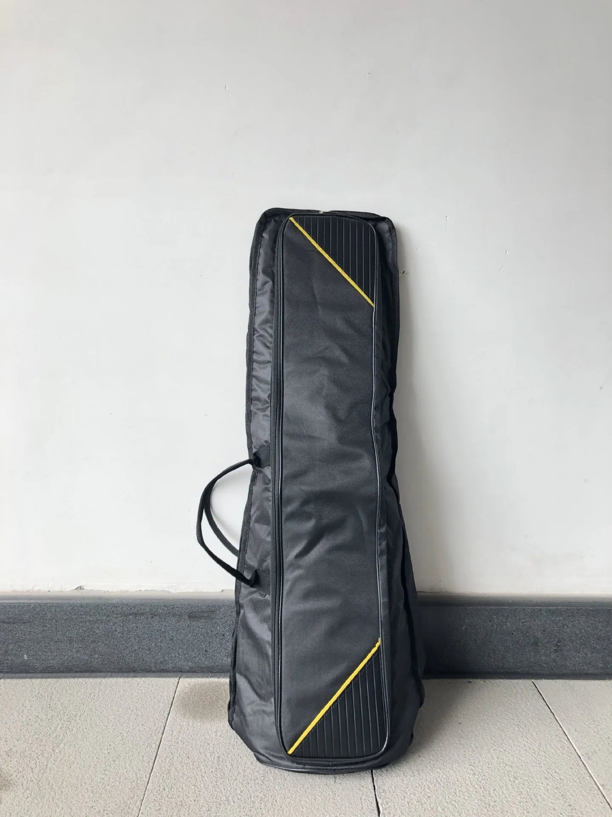 Black tenor trombone bag made of Oxford cloth with padded interior and outer pocket