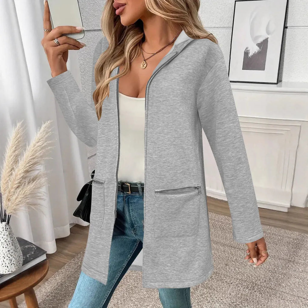 Grey loose fit mid-length women's cardigan coat with front pockets on a hanger.