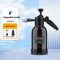 Black 2L hand-held foam watering can sprayer with ergonomic handle and pump mechanism.