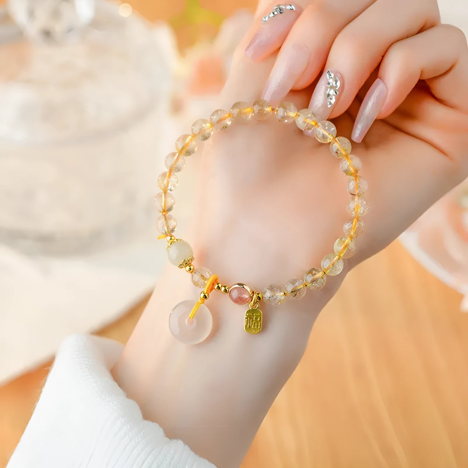 Gold rutilated quartz crystal bracelet with peace buckle closure and blessing card pendant