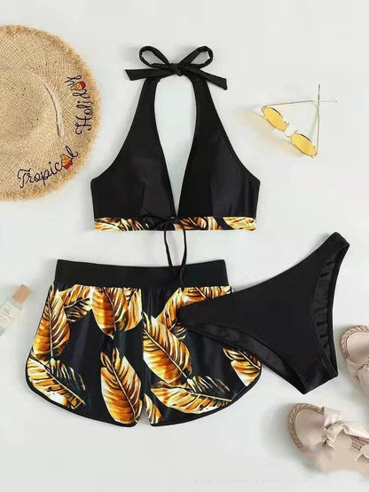 Chic leaf-patterned women's swimsuit set with bikini top, bottoms, and matching shorts in various vibrant colors