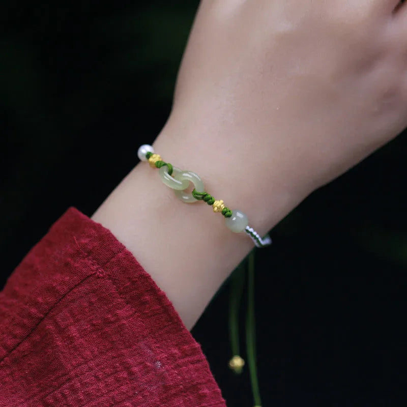 Natural Hetian jade woven bracelet with flexible wire construction and hollow out design