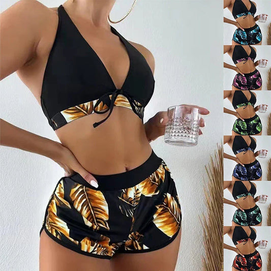 Chic leaf-patterned women's swimsuit set with bikini top, bottoms, and matching shorts in various vibrant colors