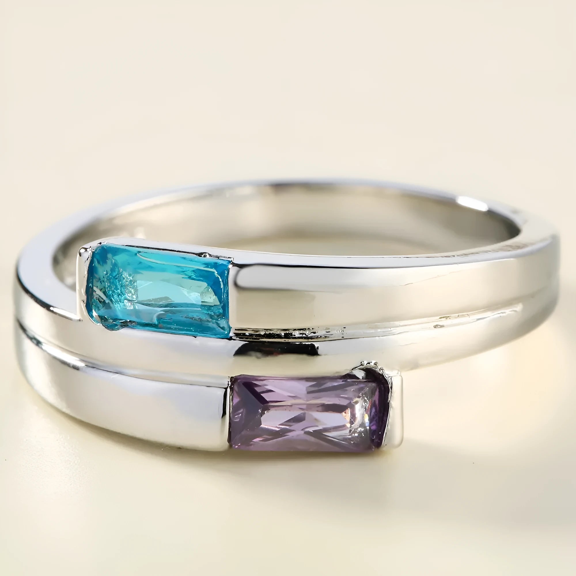 Silver electroplated copper ring with a zircon stone inlaid in the band.