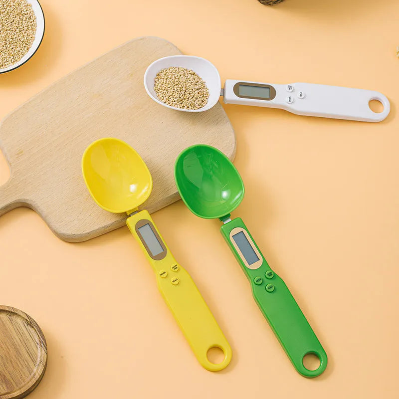 Digital spoon kitchen scale with LCD display showing weight measurement in grams