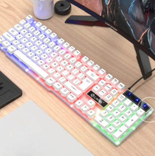 TX35 mechanical feeling keyboard in white and black rainbow colour options next to a laptop.