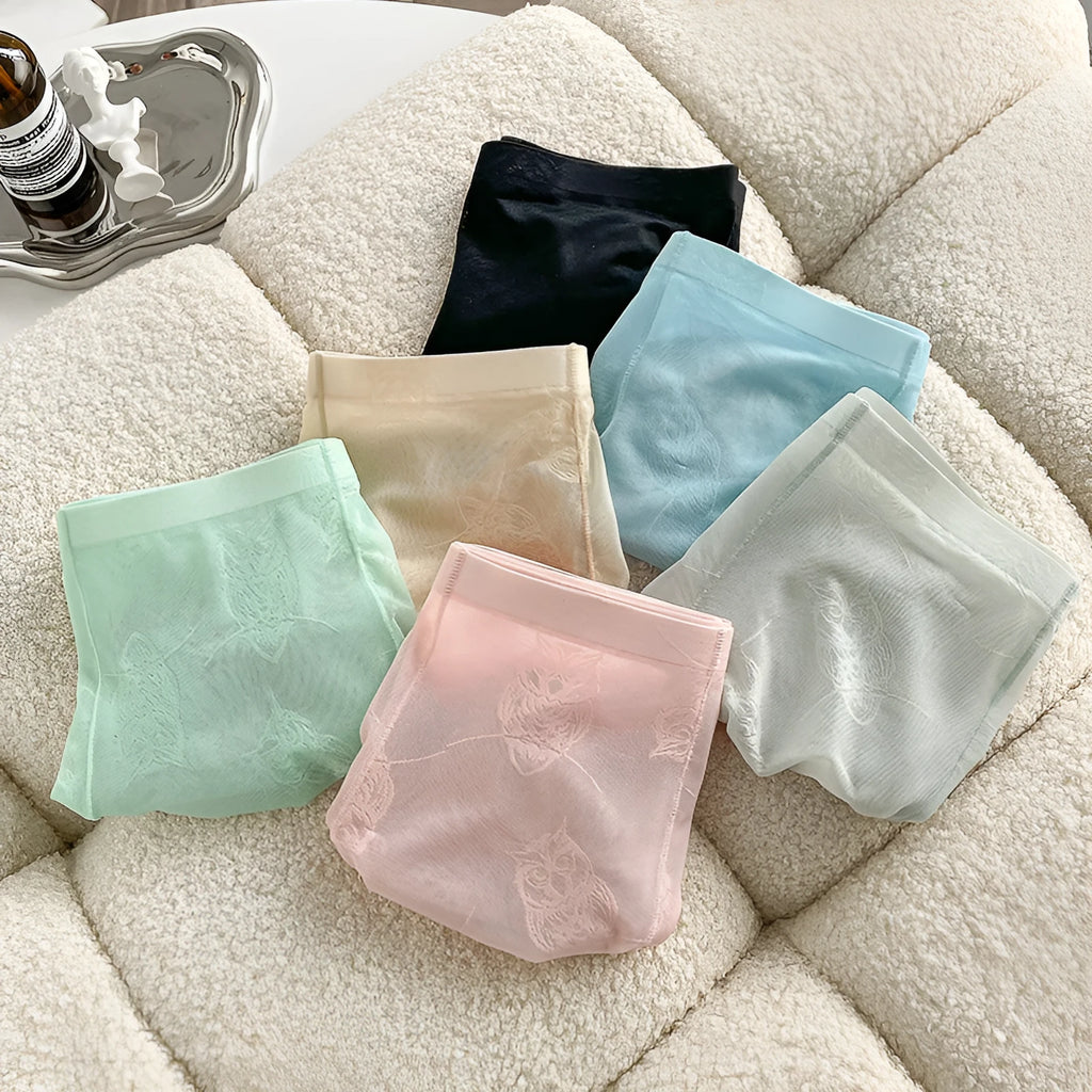 Men's ice silk seamless boxers in mint green – lightweight transparent nylon underwear with mid waist design on white background