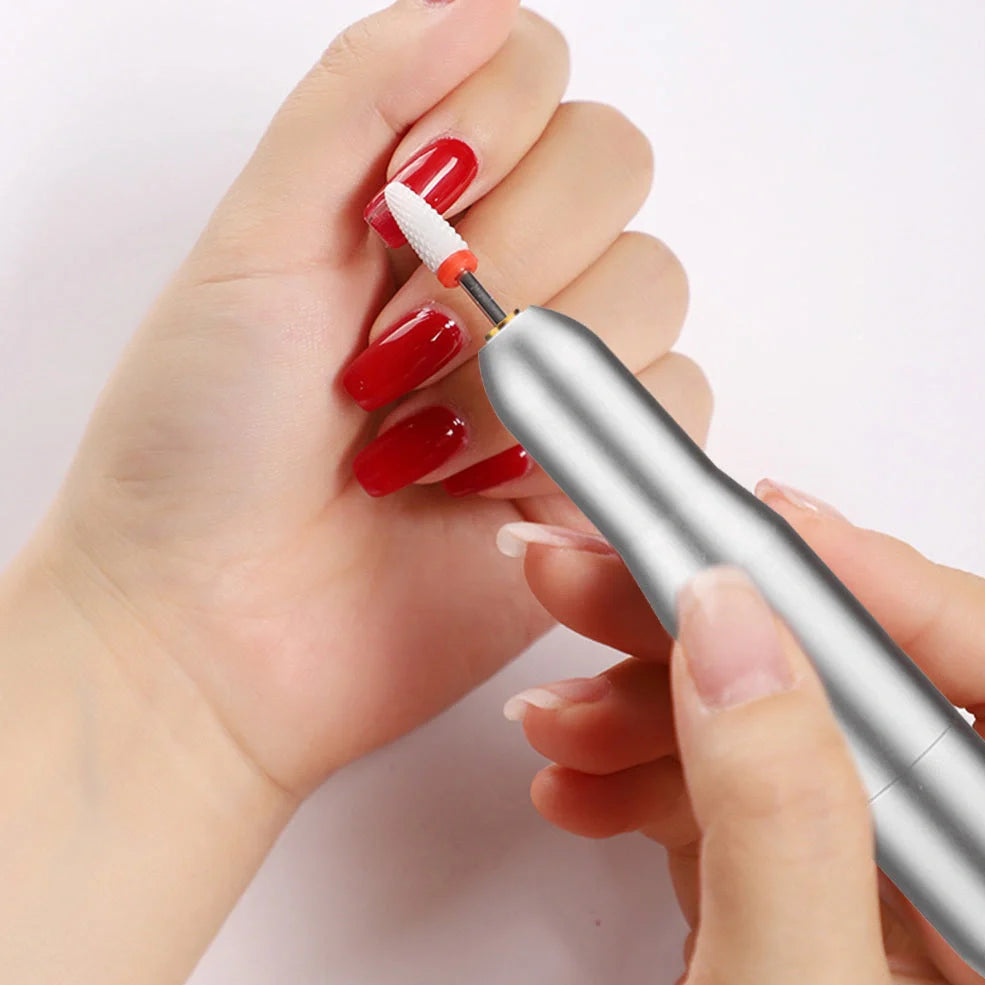 Pink USB-charging electric nail drill machine with 6 grinding heads and power cord