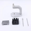 Silver tool steel multi-purpose press strap and pin removal tool on a work surface.