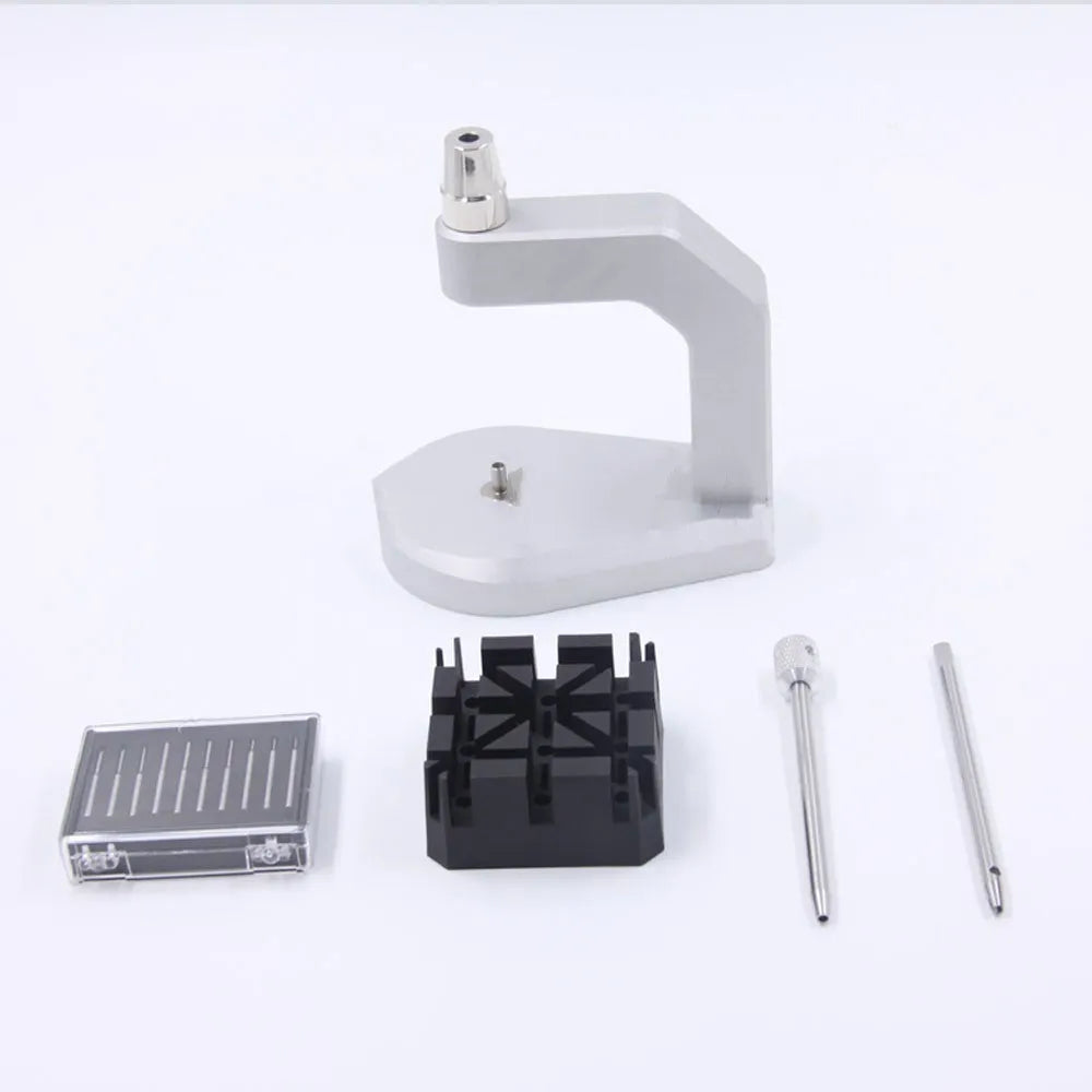 Silver tool steel multi-purpose press strap and pin removal tool on a work surface.
