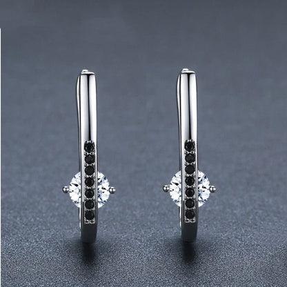 Black U-shaped copper earrings with ellipse design details