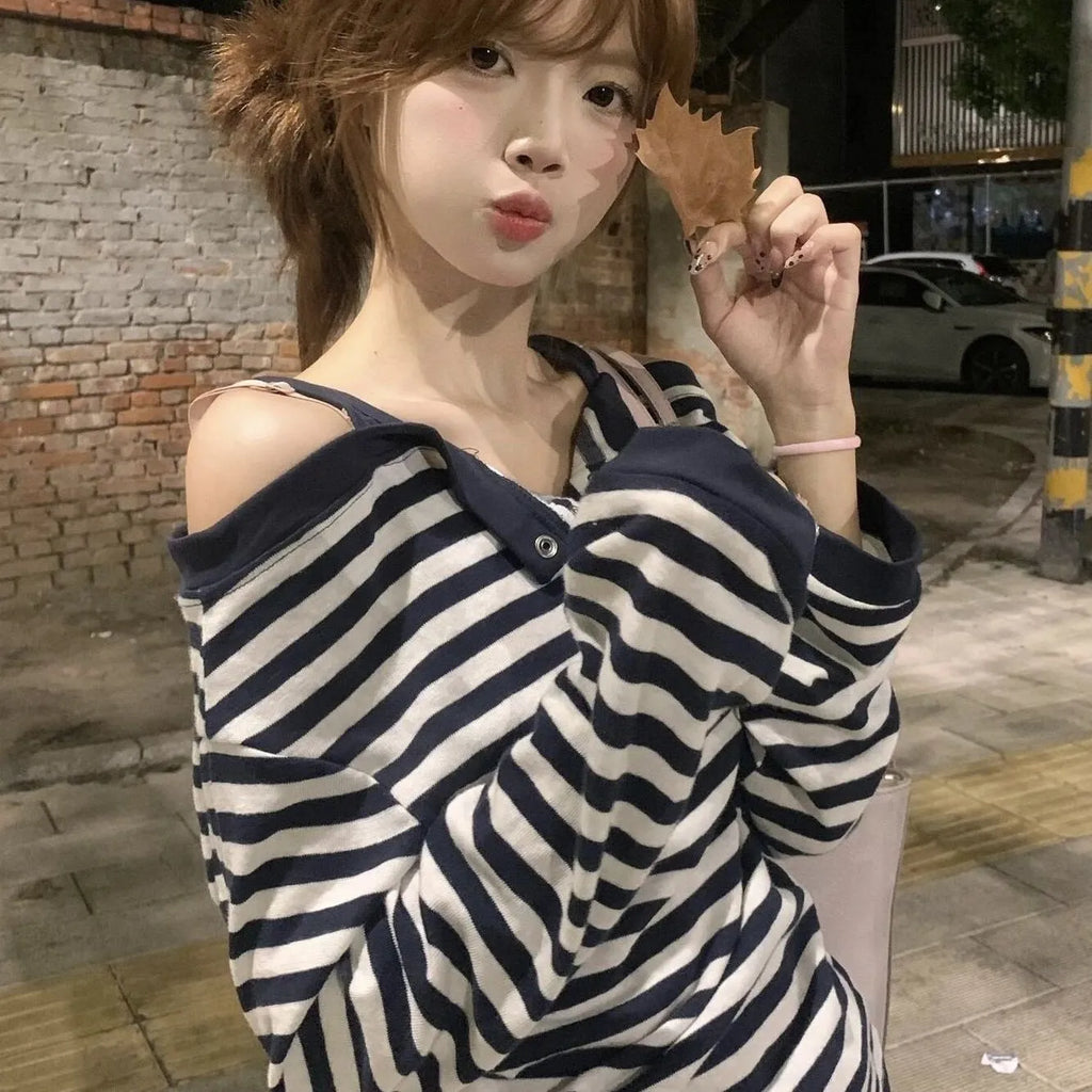 Dark blue Korean-style oversized women's t-shirt with long sleeves, stripes, and embroidery details.
